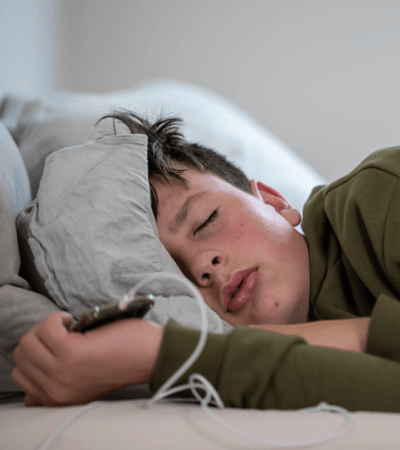 boy sleeping with phone