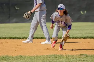 Teenager playing baseball